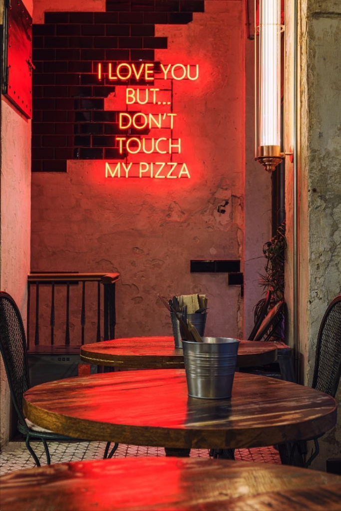 Use of neon to signal slogan or campaign name.